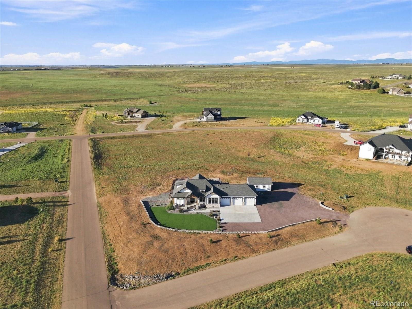 Aerial view of the Stoneleigh Road home, acreage, and surrounding countryside